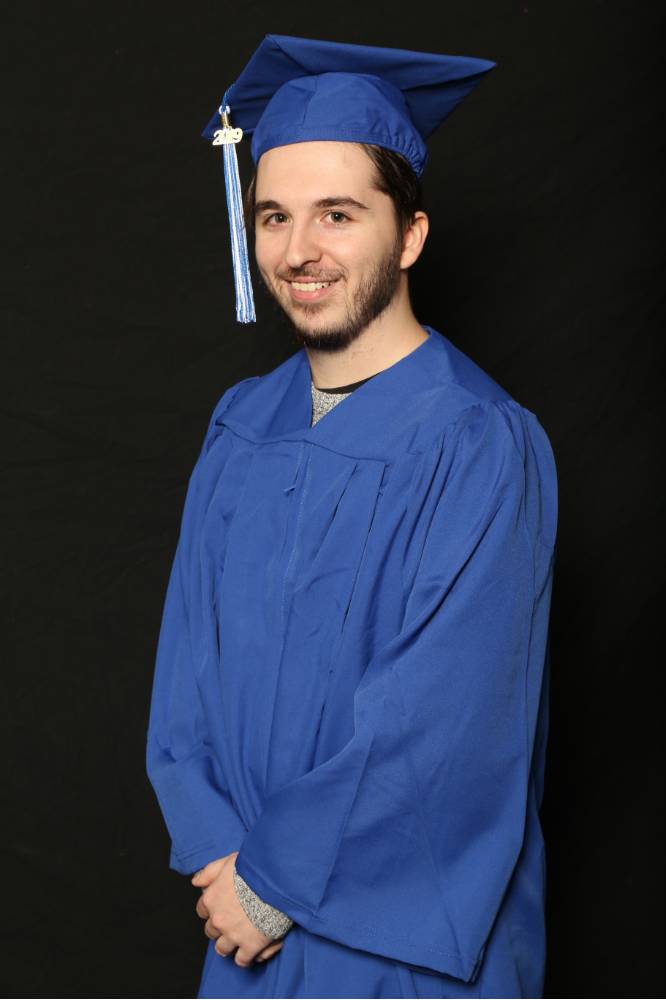 man in blue cap and gown